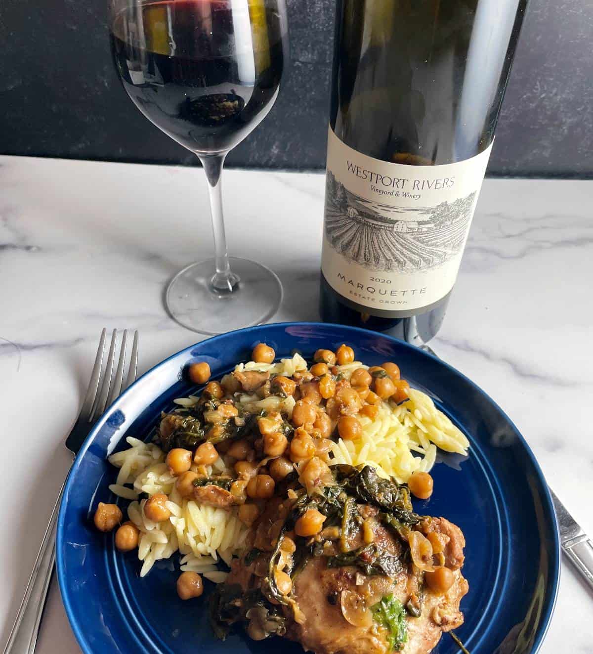 Marquette red wine served with a plate of Moroccan chicken with chickpeas and orzo.